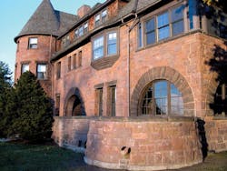 In bringing back the luster of the original redstone brick faade at the University of Vermonts Redstone Hall, originally built In bringing back the luster of the original redstone brick faade at the University of Vermonts Redstone Hall, originally built