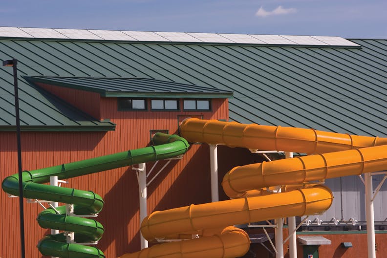 The four-inch-thick Metl-Span insulated roof panels are finished in Cool Forest Green on the exterior and Polar White on the int