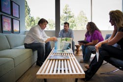 Randy Peterson, President of HMC Architects, confers with colleagues Billy Chundak, Jeannette Warren, and Alicia Strom on a proj Randy Peterson, President of HMC Architects, confers with colleagues Billy Chundak, Jeannette Warren, and Alicia Strom on a proj