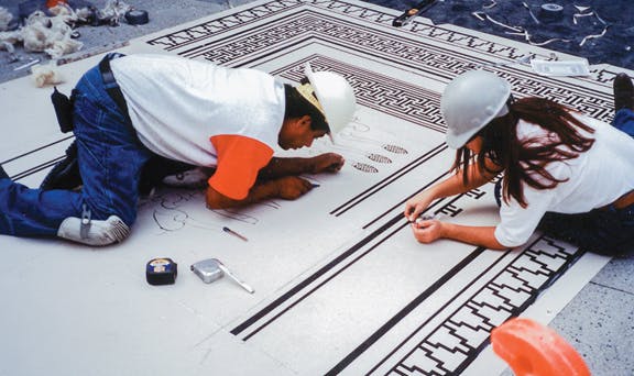 Decorative concrete is growing in popularity for both interior and exterior applications. The trade workers shown here are weed