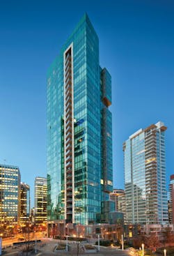 The 33-story Three Harbour Green tower is the final piece of a three-building development fronting seven acres of waterfront park space in Vancouver. IBI Group provided architectural and interior design services on the project, which incorporates residential units on the west side of the tower and office space on the east portion. The two functions are divided on the exterior by a series of stone-clad sky gardens hanging off the building. PHOTO: BOB MATHESON The 33-story Three Harbour Green tower is the final piece of a three-building development fronting seven acres of waterfront park space in Vancouver. IBI Group provided architectural and interior design services on the project, which incorporates residential units on the west side of the tower and office space on the east portion. The two functions are divided on the exterior by a series of stone-clad sky gardens hanging off the building. PHOTO: BOB MATHESON