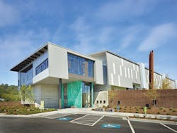 Mortenson Construction (design-build) teamed up with Seattle Public Utilities Solid Waste Division to create a new solid waste transfer station. The 98,000-sf LEED Gold facility includes a drive-through tunnel for more efficient and safer loading, as well as a complete separation between commercial and self-haul traffic. Rainwater is recaptured for irrigation and truck wash-down. Photo: Benjamin Benschneider Mortenson Construction (design-build) teamed up with Seattle Public Utilities Solid Waste Division to create a new solid waste transfer station. The 98,000-sf LEED Gold facility includes a drive-through tunnel for more efficient and safer loading, as well as a complete separation between commercial and self-haul traffic. Rainwater is recaptured for irrigation and truck wash-down. Photo: Benjamin Benschneider
