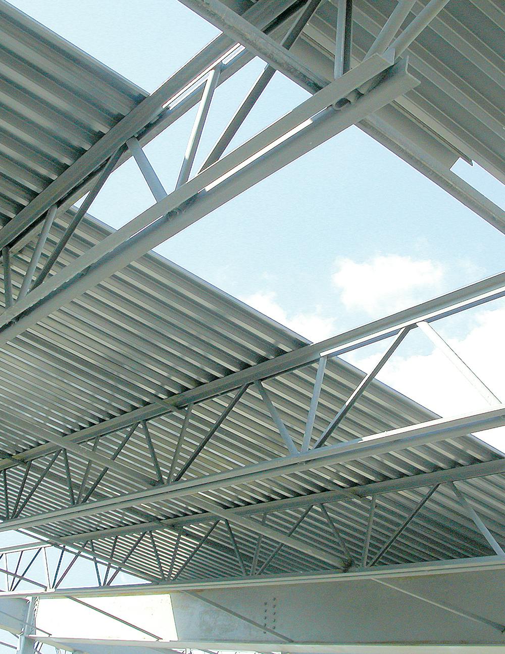 Installation of steel deck (here, from manufacturer New Millennium Building Systems) in progress. For additional technical infor