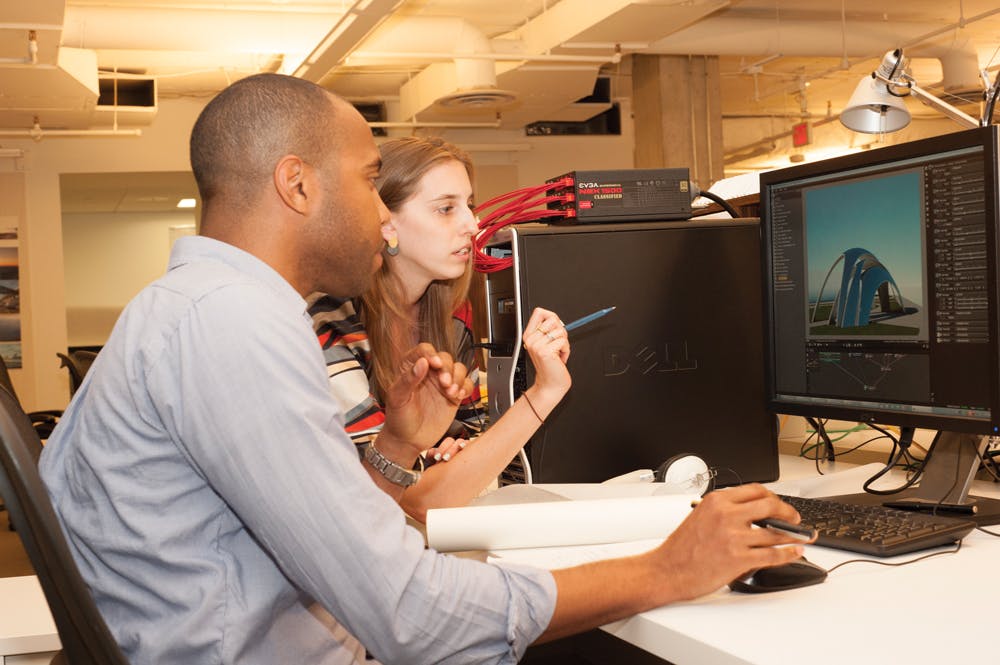 Jevon Carrington and Leila Schey, both Architectural Designers in Genslers Washington, D.C., office, collaborate on a project u