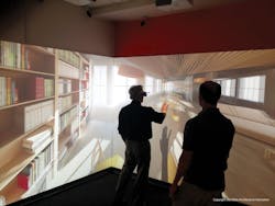 A user navigates a virtual reality model of a proposed commercial office at DPR Constructions Virtual Reality Showroom in Redwo A user navigates a virtual reality model of a proposed commercial office at DPR Constructions Virtual Reality Showroom in Redwo