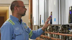 Navien tankless Water heaters being checked by plumbing contractor