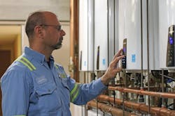 Navien tankless Water heaters being checked by plumbing contractor Navien tankless Water heaters being checked by plumbing contractor