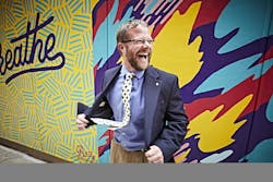 Under 40 philanthropist in front of mural Under 40 philanthropist in front of mural