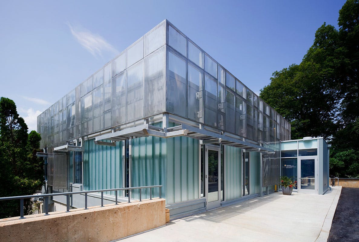 The new design of the Genetics Laboratory included exterior enclosures consisting of insulated metal panels, channel glass, and