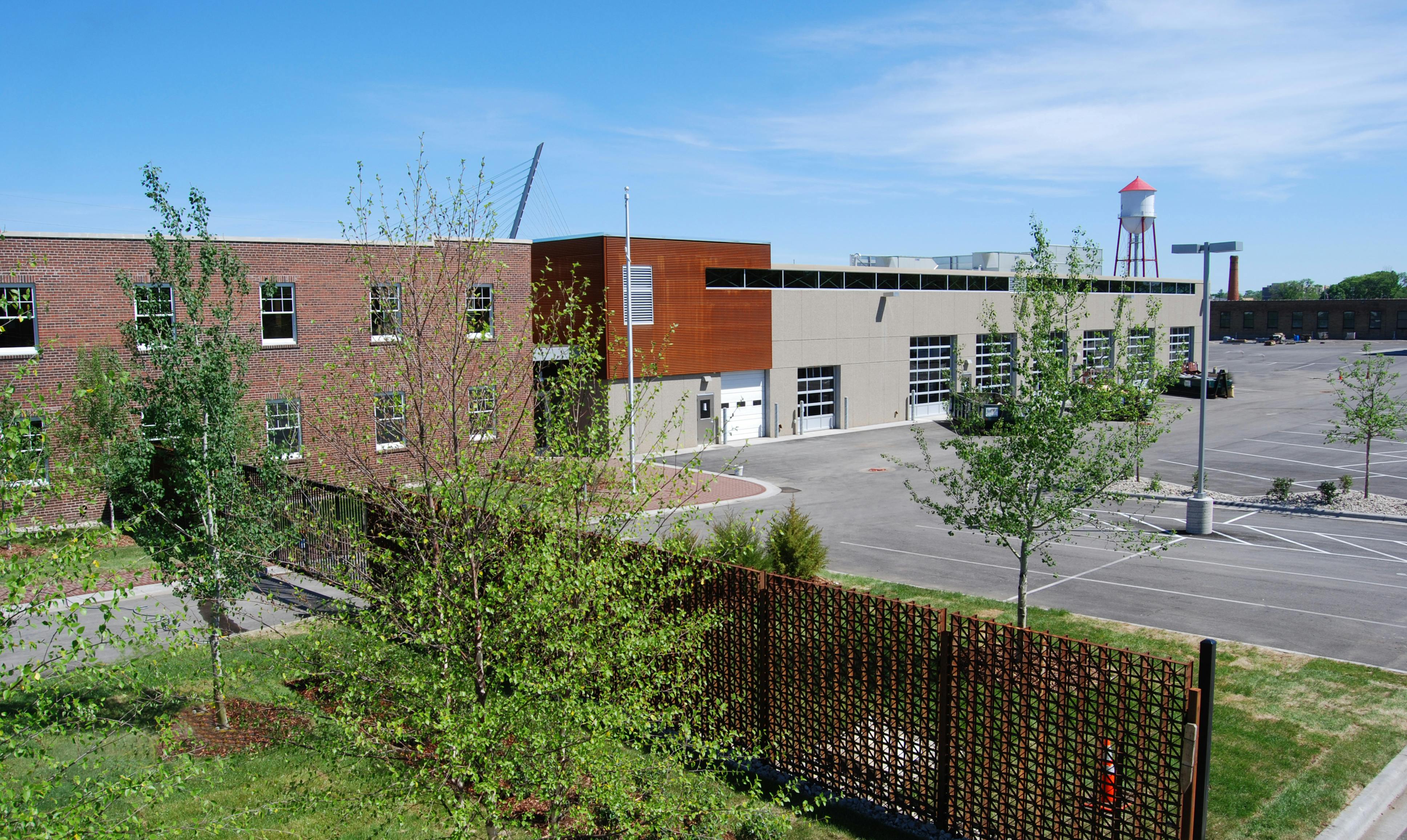 Fully glazed garage doors and windows maximize daylight in the maintenance bay. In-floor heating throughout the shop area saves