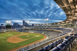 Variegated brick at the street level, brushed aluminum, and a mixture of clear and translucent glass surround the top of the sta Variegated brick at the street level, brushed aluminum, and a mixture of clear and translucent glass surround the top of the sta