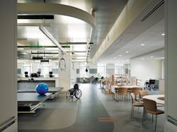 Metal tiles were used in the physical therapy gymnasium to give the space a more rugged feel for recovering soldiers. Harnesses Metal tiles were used in the physical therapy gymnasium to give the space a more rugged feel for recovering soldiers. Harnesses