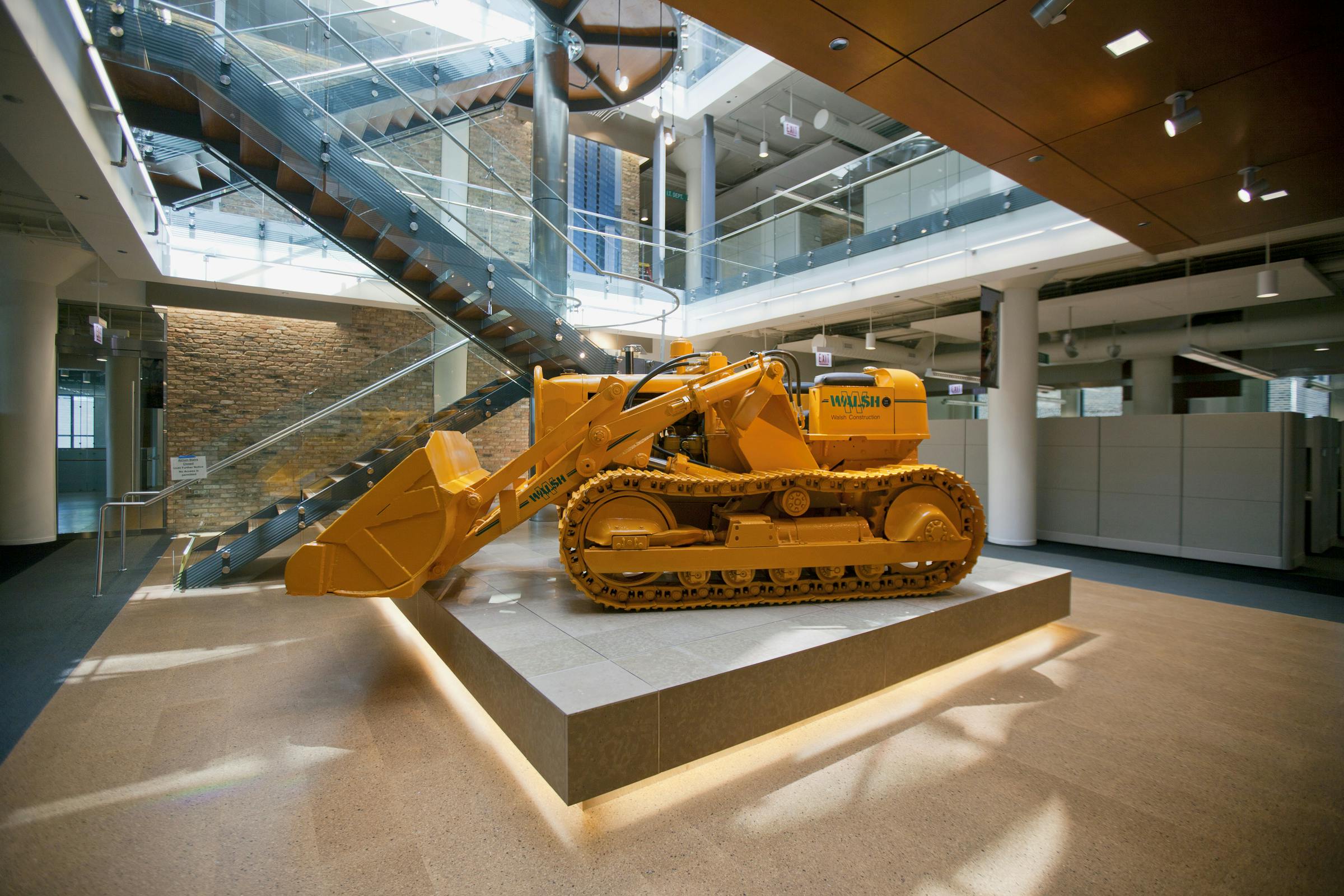 A 1953 Allis-Chalmers bulldozer in the central atrium of the Walsh Training and Conference Center, Chicago. The 93,000-sf LEED P