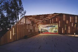 For a project at Claremont University Consortium, Claremont, N.Y., architect LTL and lighting designer Lumen Architecture used lighting to transform a steel-framed warehouse. An exterior slatted wooden screen is interspersed with LED strips, creating a striking nighttime effect. Photo: Michael Moran / Courtesy Lumen Architecture For a project at Claremont University Consortium, Claremont, N.Y., architect LTL and lighting designer Lumen Architecture used lighting to transform a steel-framed warehouse. An exterior slatted wooden screen is interspersed with LED strips, creating a striking nighttime effect. Photo: Michael Moran / Courtesy Lumen Architecture