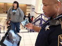 Collin County Sheriff Deputy George White checks a hallway in one of Anna (Texas) ISDs buildings while monitoring two others on Collin County Sheriff Deputy George White checks a hallway in one of Anna (Texas) ISDs buildings while monitoring two others on