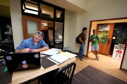 A student bedroom at the College of Wooster (Ohio) capitalizes on 12-foot-high ceilings to optimize overhead storage space, extr A student bedroom at the College of Wooster (Ohio) capitalizes on 12-foot-high ceilings to optimize overhead storage space, extr