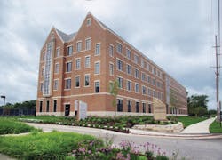 Precast units from Coreslab Structures (left) being put in place at Valparaiso (Ind.) Universitys new student residence. A bath Precast units from Coreslab Structures (left) being put in place at Valparaiso (Ind.) Universitys new student residence. A bath