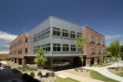 Metal wall panels’ deep shadow lines break up massing of Georgia school Metal wall panels’ deep shadow lines break up massing of Georgia school