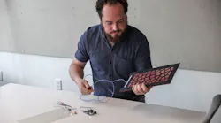 Dane Stokes, a Design Technology Specialist with ZGF Architects, shown with floor sensors, AEC Innovators, BD+C
