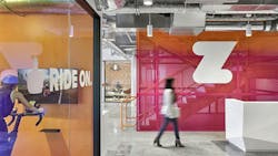 Zwift central stair, reception area, and stationary bike Zwift central stair, reception area, and stationary bike