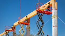 Workers put mass timber beams in place on a timber project in early construction stage. Photo: Marco Zecchin, Image Center