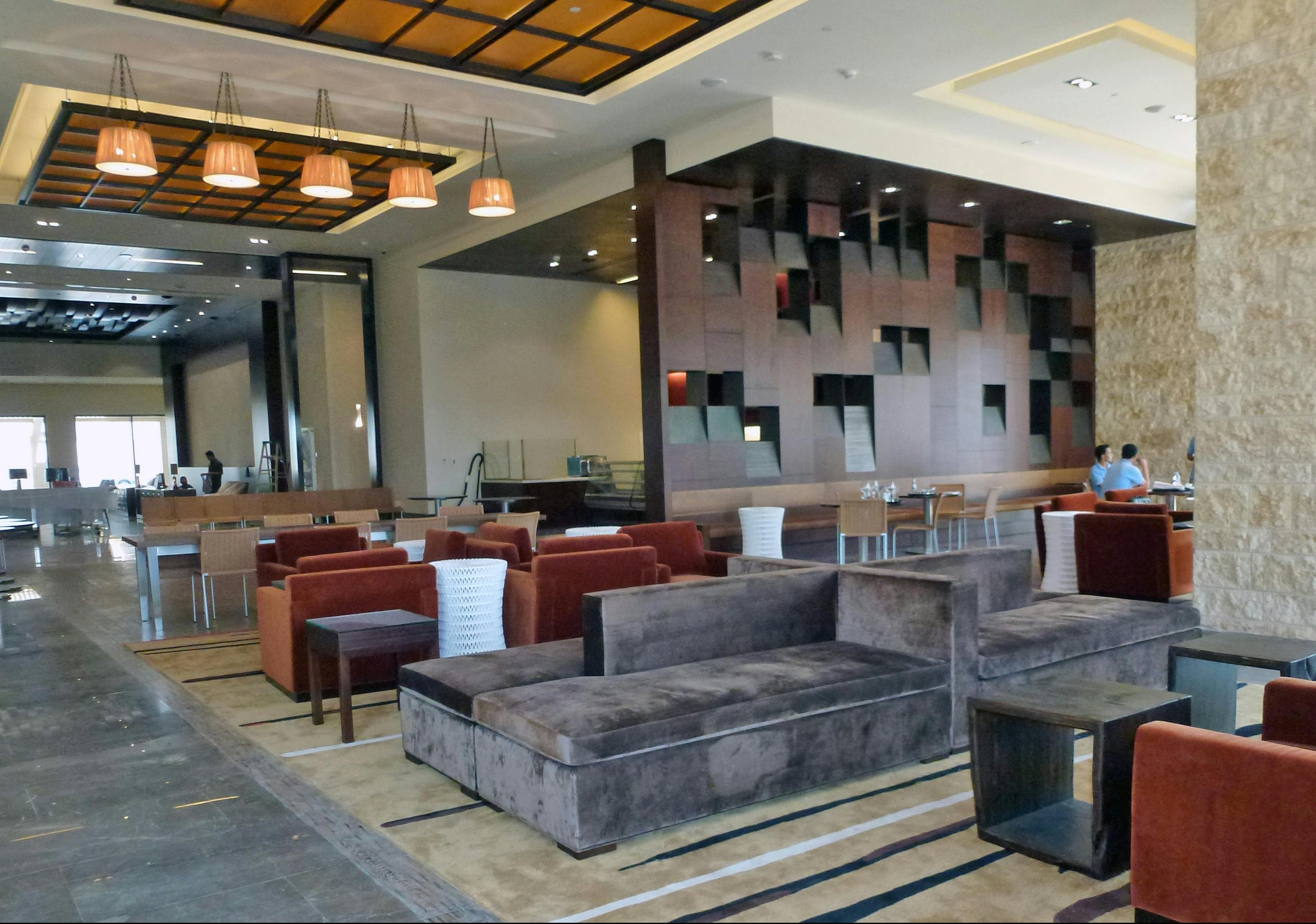 Hotel common areas have soaring ceilings that lead the eye up to the uniquely designed, winged rooftops that are the signature o