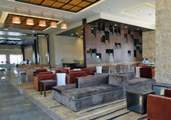 Hotel common areas have soaring ceilings that lead the eye up to the uniquely designed, winged rooftops that are the signature o Hotel common areas have soaring ceilings that lead the eye up to the uniquely designed, winged rooftops that are the signature o