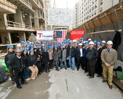 Hundreds Of Construction Trades People Celebrate Reaching The Top Of Concrete Structure For Facility Hundreds Of Construction Trades People Celebrate Reaching The Top Of Concrete Structure For Facility