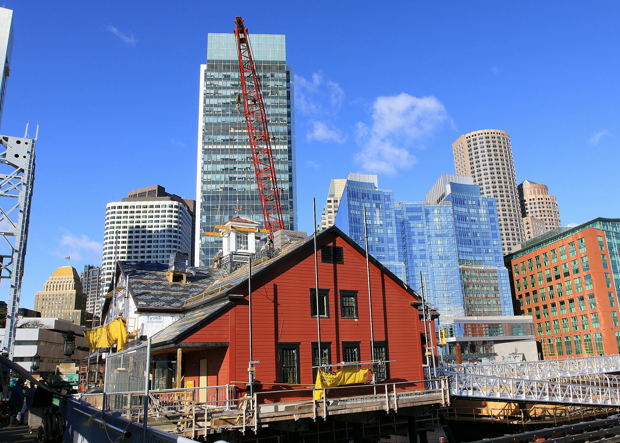Officials from the Boston Tea Party Ships & Museum to celebrate the raising and placement of the cupola on the roof of the museu