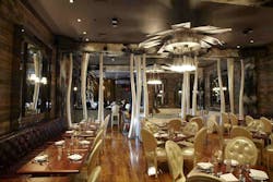 Osso's Walls Feature Barn Wood Finishes, Fabric And Cowhide Coverings, Inset Back Lighting And Hand Cut Mirrors Osso's Walls Feature Barn Wood Finishes, Fabric And Cowhide Coverings, Inset Back Lighting And Hand Cut Mirrors