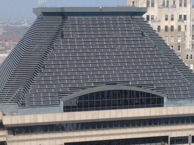 The modules are part of this 122.4 kW rooftop array. At an elevation of 737 feet from the ground, this is the