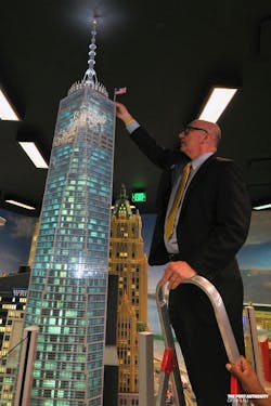 Steve Plate, Director of World Trade Center Construction places a LEGO US Flag on a LEGO replica of One World Trade Center during the model's unveiling at LEGOLAND Discovery Center Westchester on June 28, 2013. (Photo Credit: Port Authority/ Mike Dombrowski) Steve Plate, Director of World Trade Center Construction places a LEGO US Flag on a LEGO replica of One World Trade Center during the model's unveiling at LEGOLAND Discovery Center Westchester on June 28, 2013. (Photo Credit: Port Authority/ Mike Dombrowski)