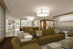 The new prototype's open, social lobby space was designed to create a comfortable setting for extended-stay guests to work, soci The new prototype's open, social lobby space was designed to create a comfortable setting for extended-stay guests to work, soci