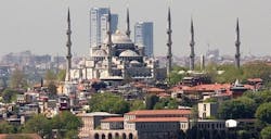 The High Rise Development Can Be Seen Looming Behind The 17th Century Sultan Ahmed Mosque, Also Known As The Blue Mosque The High Rise Development Can Be Seen Looming Behind The 17th Century Sultan Ahmed Mosque, Also Known As The Blue Mosque