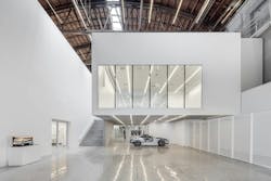 This image from the Fabrication Lab on level one features a “cut away” Jaguar F-Type and shows the hovering flexible lecture / gallery space above. Photo: Joshua White This image from the Fabrication Lab on level one features a “cut away” Jaguar F-Type and shows the hovering flexible lecture / gallery space above. Photo: Joshua White