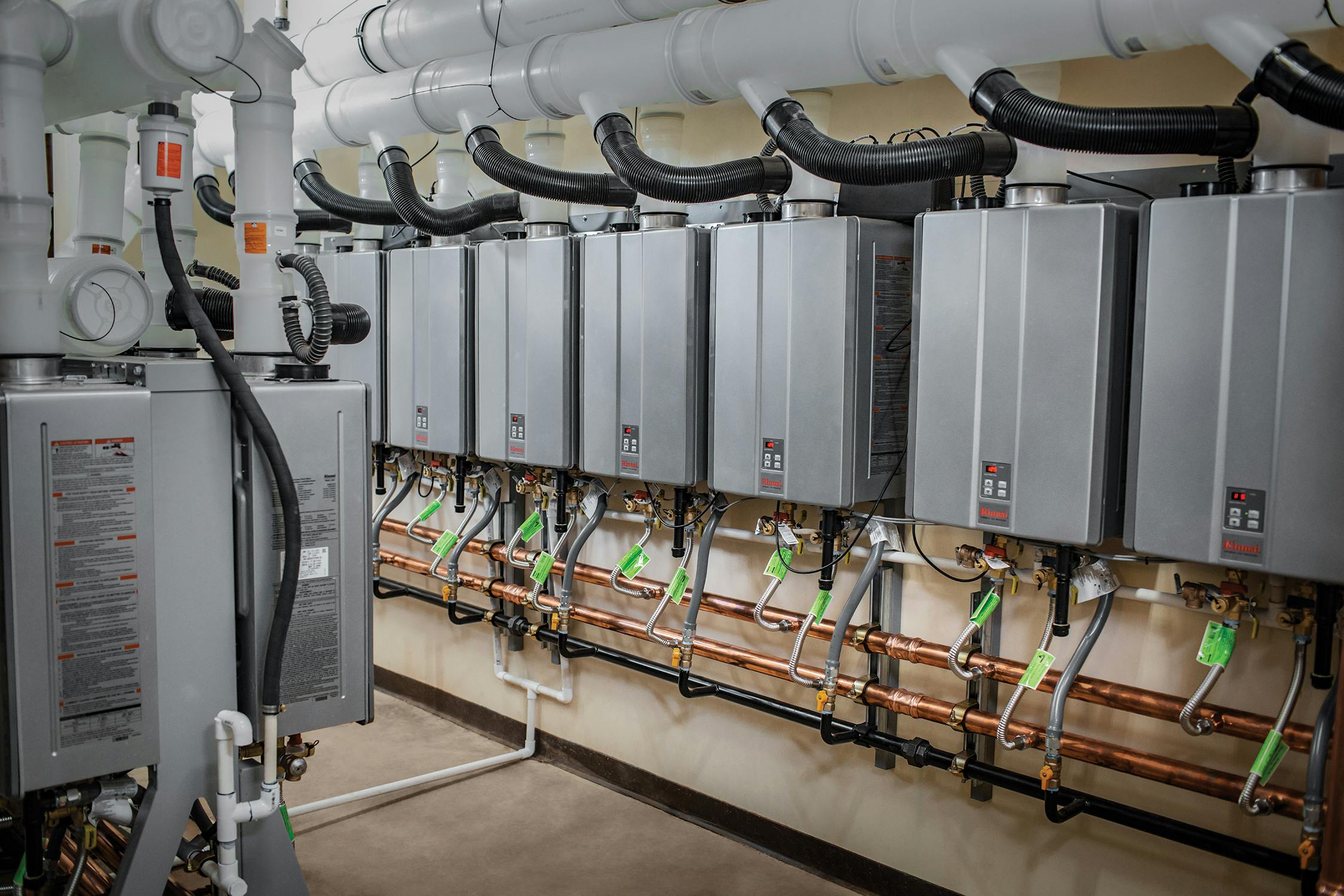 Multiple Propane Tankless Water Heaters Installed In An Apartment Building