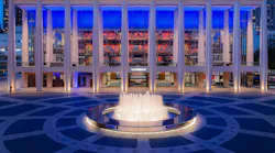 Tod Williams Billie Tsien Architects specified a band of custom glass from Bendheim, illuminated in blue, to perform double duty at Lincoln Center's new David Geffen Hall. Photo: Lawrence Sumulong, © Lincoln Center for the Performing Arts