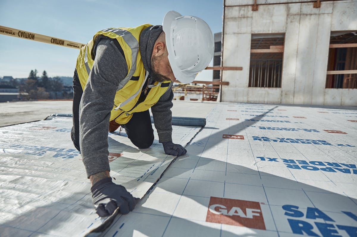 GAF SA Vapor Retarder XL being installed at The Revington rental housing complex, Worcester, Mass. Photo: Courtesy GAF