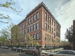 Mulligan School Apartments occupy a 25,000-sf lot between Sheffield Avenue and the CTA elevated line Mulligan School Apartments occupy a 25,000-sf lot between Sheffield Avenue and the CTA elevated line