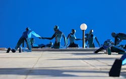 Blue three dimensional human figures in Pale Blue Dot art installation Blue three dimensional human figures in Pale Blue Dot art installation
