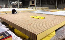 Workers Fabricated And Waterproofed 430 Sto Panel® Finished Exterior Wall Panels In A Controlled Environment For The Façade Of The Hub Workers Fabricated And Waterproofed 430 Sto Panel® Finished Exterior Wall Panels In A Controlled Environment For The Façade Of The Hub