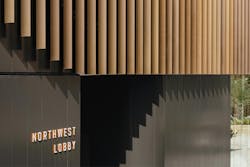 Warm wood tones and crisp MCM paneling ebb and flow in the interior and exterior of Moody Center Warm wood tones and crisp MCM paneling ebb and flow in the interior and exterior of Moody Center