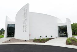 Closeup of white building with curved walls and an entrance on each side with “Canterbury Performing Arts Center” on the front Closeup of white building with curved walls and an entrance on each side with “Canterbury Performing Arts Center” on the front