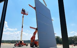 Large Section Of Panels Being Installed In Place with BZI Wall Master Large Section Of Panels Being Installed In Place with BZI Wall Master