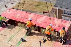 Crew Installing Pro Wood Fire Retardant Wall Components On A Building Under Construction Site In Durham, Nc Crew Installing Pro Wood Fire Retardant Wall Components On A Building Under Construction Site In Durham, Nc