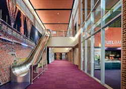 A slide connects the lobby to the concourse at Clemson University’s Alan N. Reeves Football Operations Complex in Clemson, South Carolina A slide connects the lobby to the concourse at Clemson University’s Alan N. Reeves Football Operations Complex in Clemson, South Carolina
