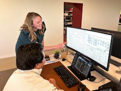 Architects talking in front of computer Architects talking in front of computer