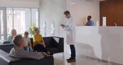 Reception area showing doctor and patients Reception area showing doctor and patients