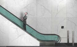 A man riding an elevator A man riding an elevator