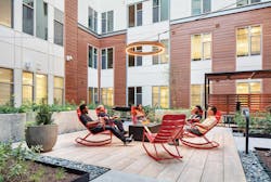 TEMPO student housing, people around a fire pit TEMPO student housing, people around a fire pit